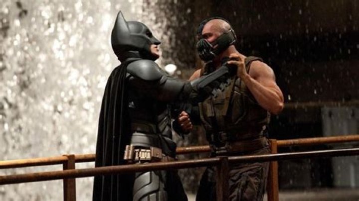 Bane (Tom Hardy) and Batman (Christian Bale) face off in a brawl in The Dark Knight Rises.