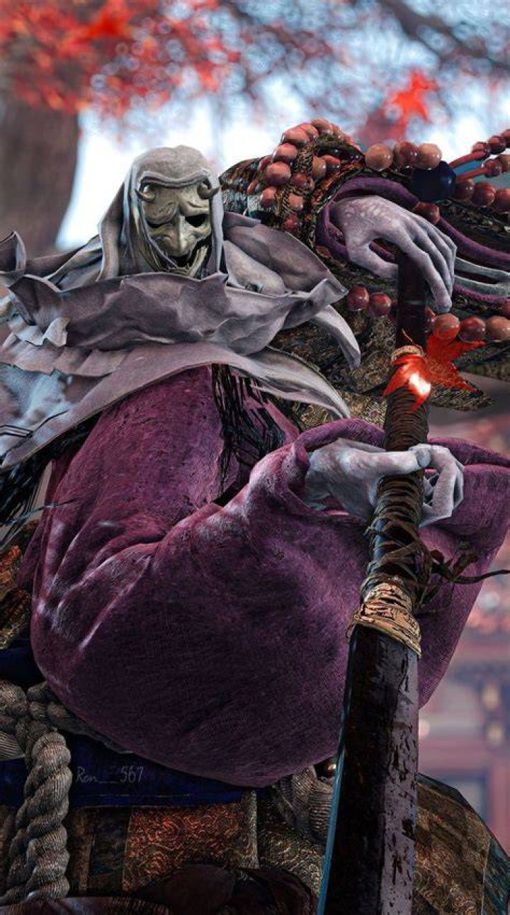 Sekiro sets a monk on fire in a screenshot from Sekiro: Shadows Die Twice.