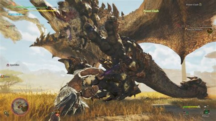 This screenshot from Monster Hunter: World shows a player character with a bow aiming at a massive monster called an Anjanath. Behind the creature is a massive canyon full of vines and ragged trees.