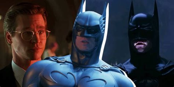 Val Kilmer as Batman surrounded by glowing neon question marks in Batman Forever.